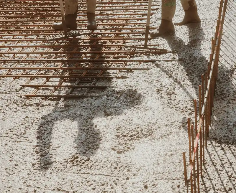 Reinforcing steel and fresh concrete during slab placement